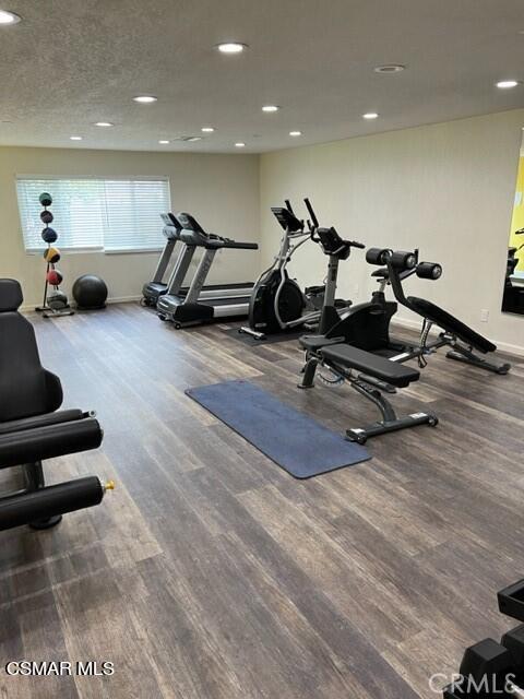 24303 Woolsey Canyon Road, Unit 26 Canoga Park, CA 91304 - Photo 25 of 28 a living room with furniture gym equipment and a view of living room