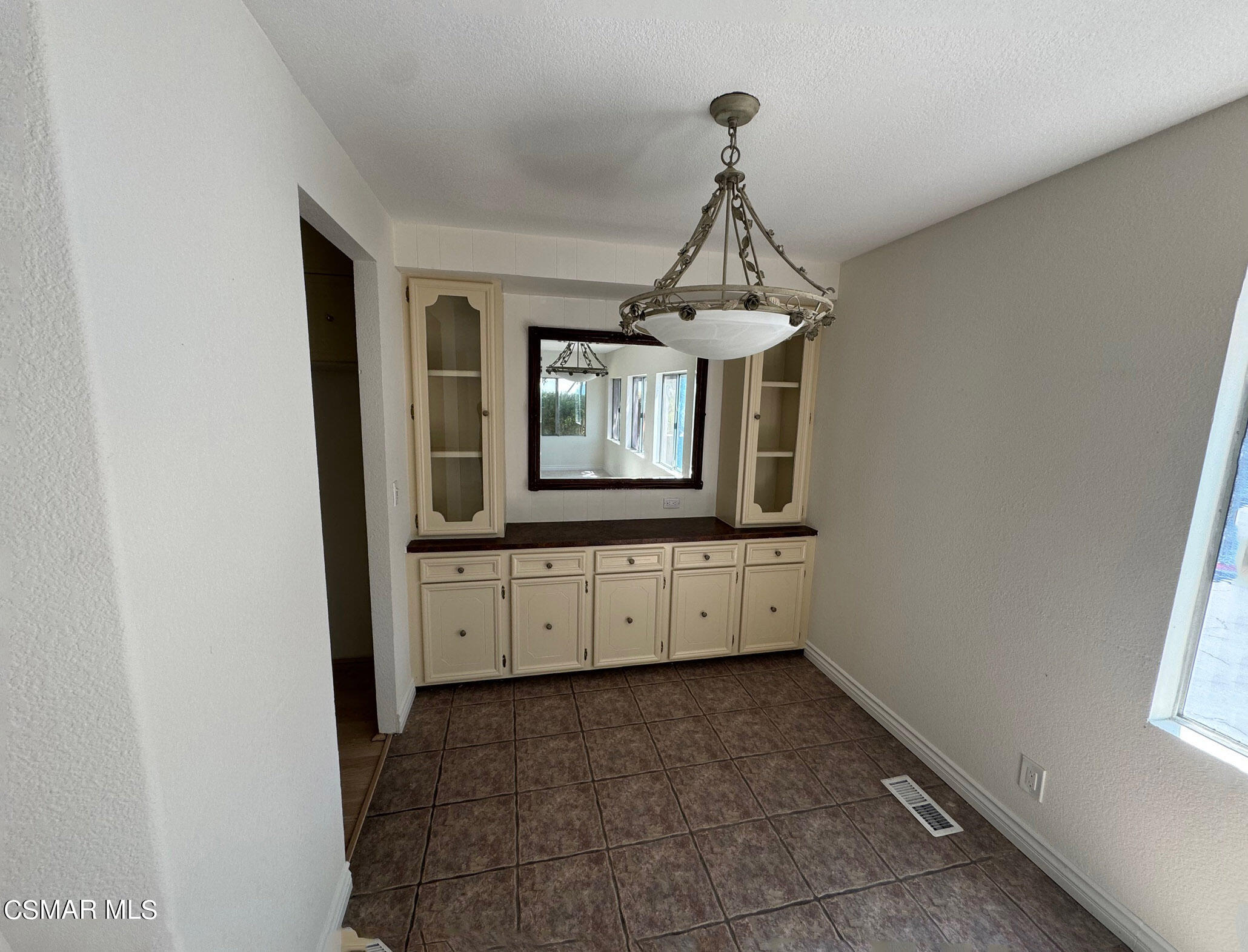 24303 Woolsey Canyon Road, Unit 26 Canoga Park, CA 91304 - Photo 5 of 28 a bathroom with a granite countertop sink and a mirror
