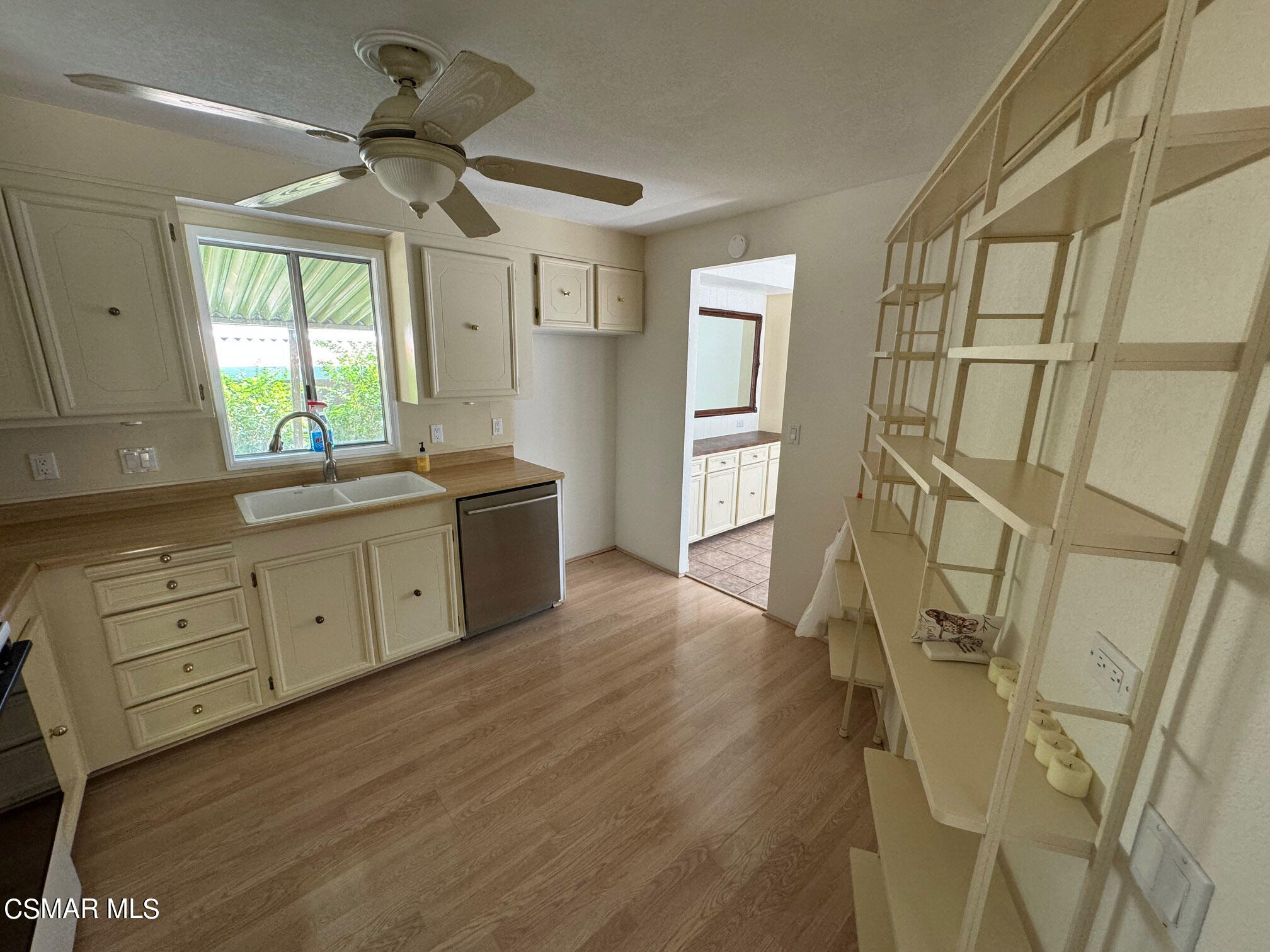 24303 Woolsey Canyon Road, Unit 26 Canoga Park, CA 91304 - Photo 7 of 28 a kitchen with stainless steel appliances a lot of counter space and a window