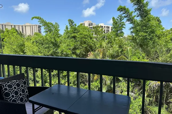 a view of a garden from a balcony