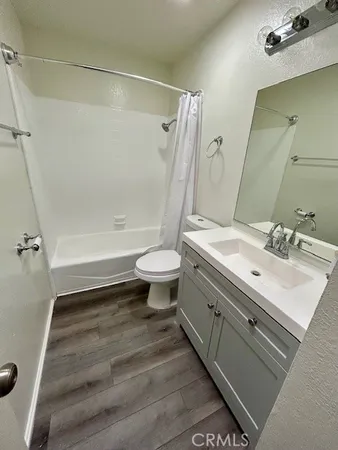 a bathroom with a sink a toilet and a bathtub