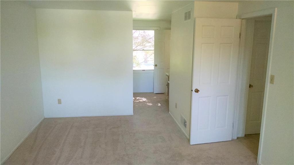 2177 Ramsey Road Monroeville, PA 15146 - Photo 22 of 25 At last, a good look at the huge master bedroom. To the left you'll see the outside of your 7x6 walk-in closet. To the right is a small vanity outside the en suite bathroom door.