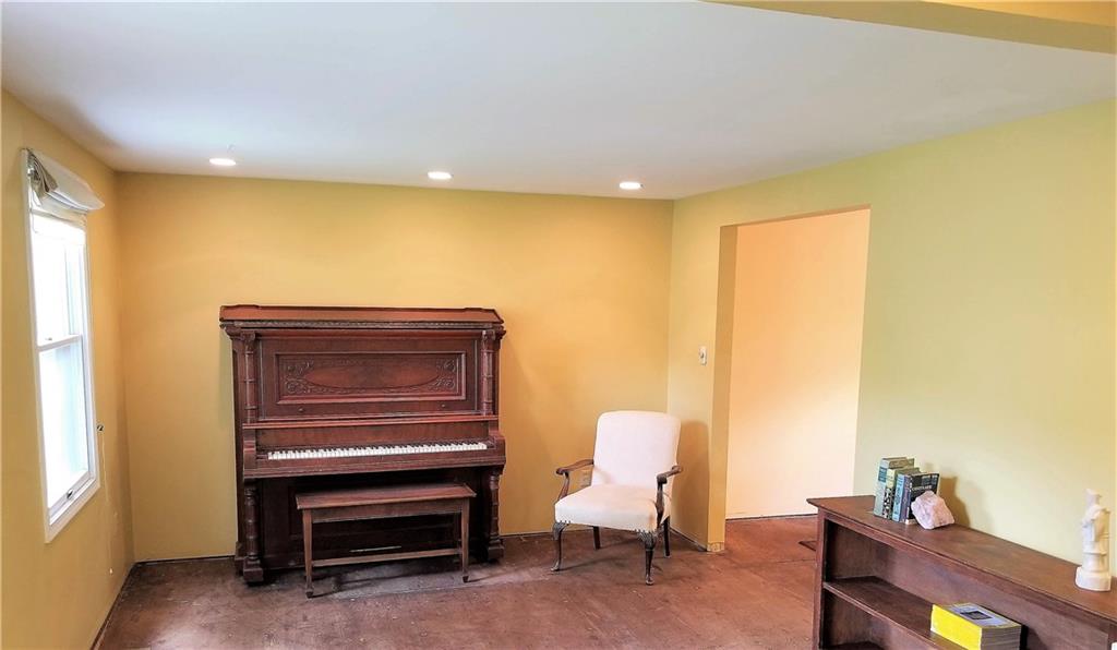 To the left of the entryway you'll find this spacious (15x11) living room filled with potential. 