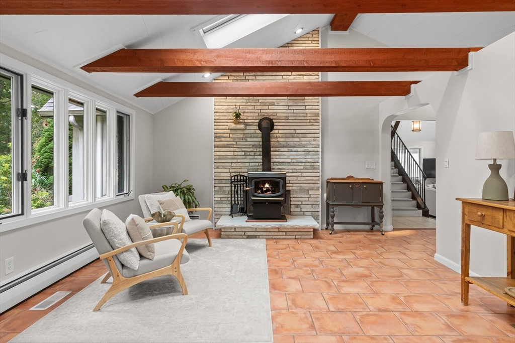 9 School Street Boxford, MA 01921 - Photo 13 of 38 a living room with furniture a fireplace and a table