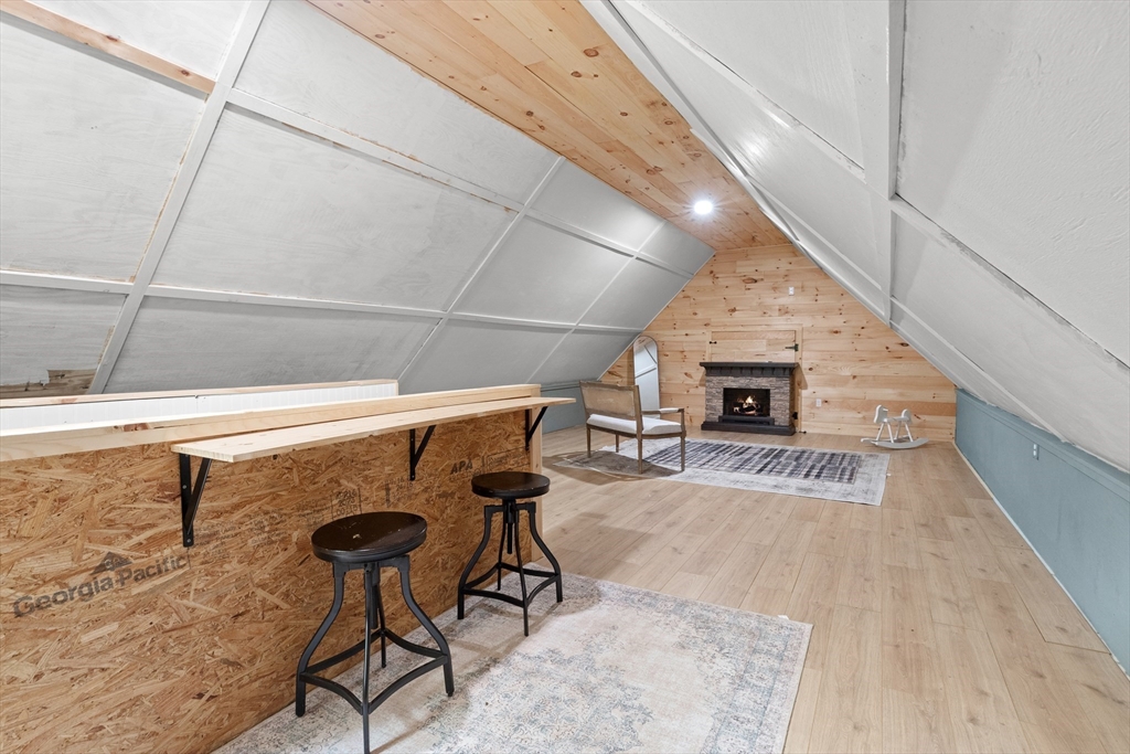 9 School Street Boxford, MA 01921 - Photo 26 of 38 a view of a livingroom with furniture and fireplace