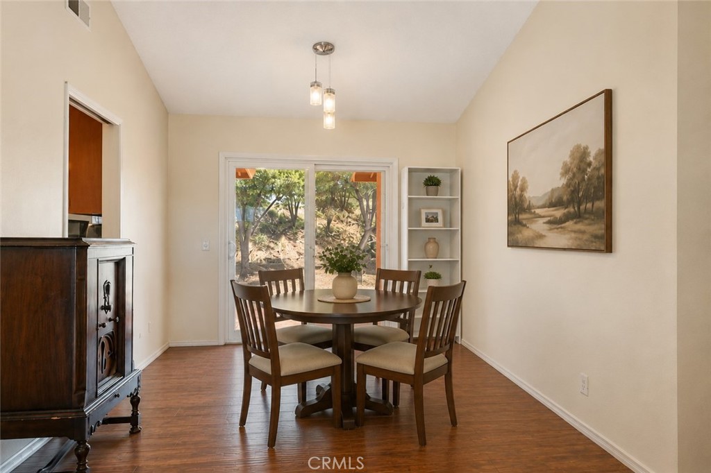 6773 Sunnyvale Drive Riverside, CA 92505 - Photo 5 of 34 AI enhanced to show potential with dining room table