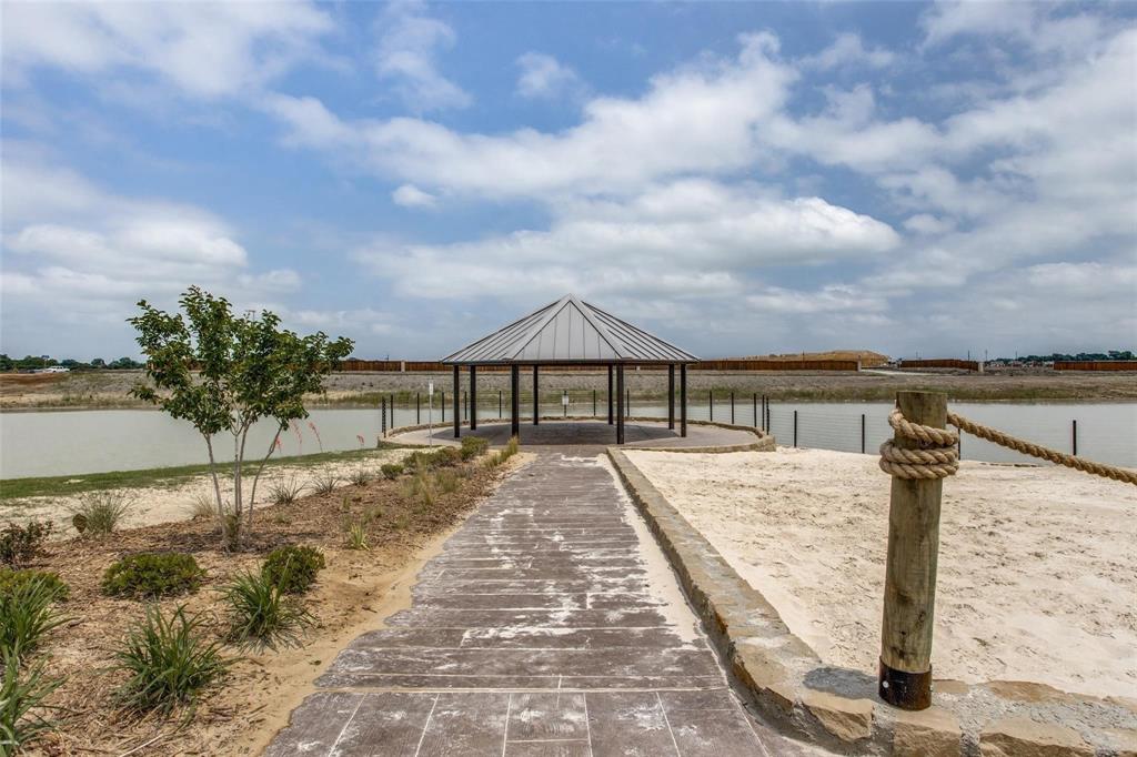 719 Biscay Way Princeton, TX 75407 - Photo 21 of 24 a view of house with swimming pool and mountains in the background