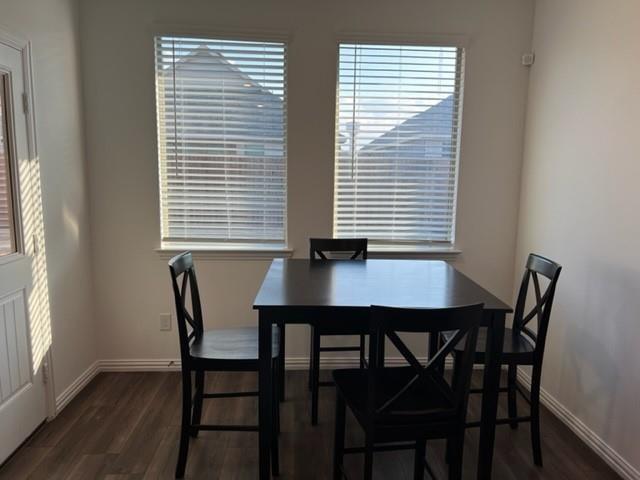 719 Biscay Way Princeton, TX 75407 - Photo 7 of 24 a view of a dining room with furniture and wooden floor