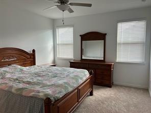 719 Biscay Way Princeton, TX 75407 - Photo 8 of 24 a bedroom with a bed and a dresser