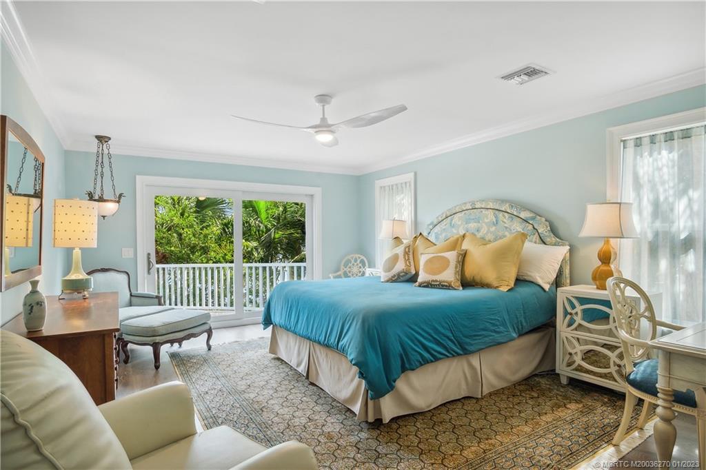 20 South Sewalls Point Road Sewall's Point, FL 34996 - Photo 21 of 44 a bedroom with a bed chair and window