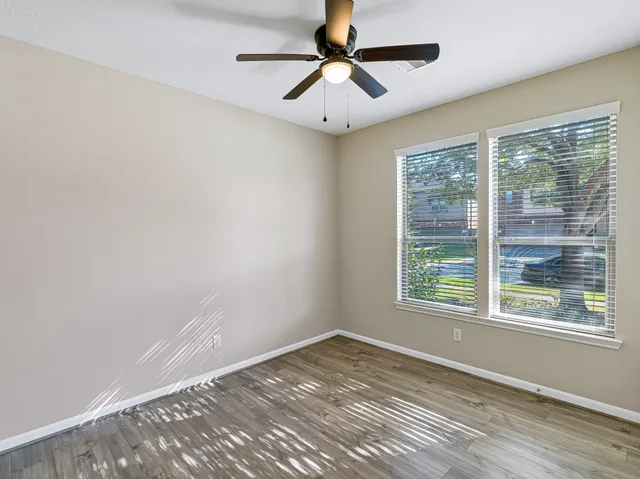 a bathroom with a sink toilet a mirror and shower