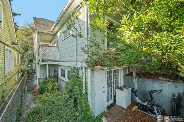 a view of a patio with table and chairs and potted plants