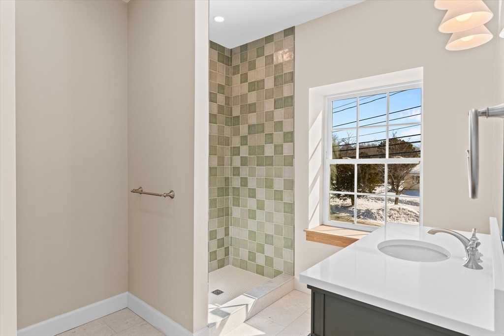 7 Justin Circle York, ME 03909 - Photo 24 of 36 a bathroom with a sink and a mirror