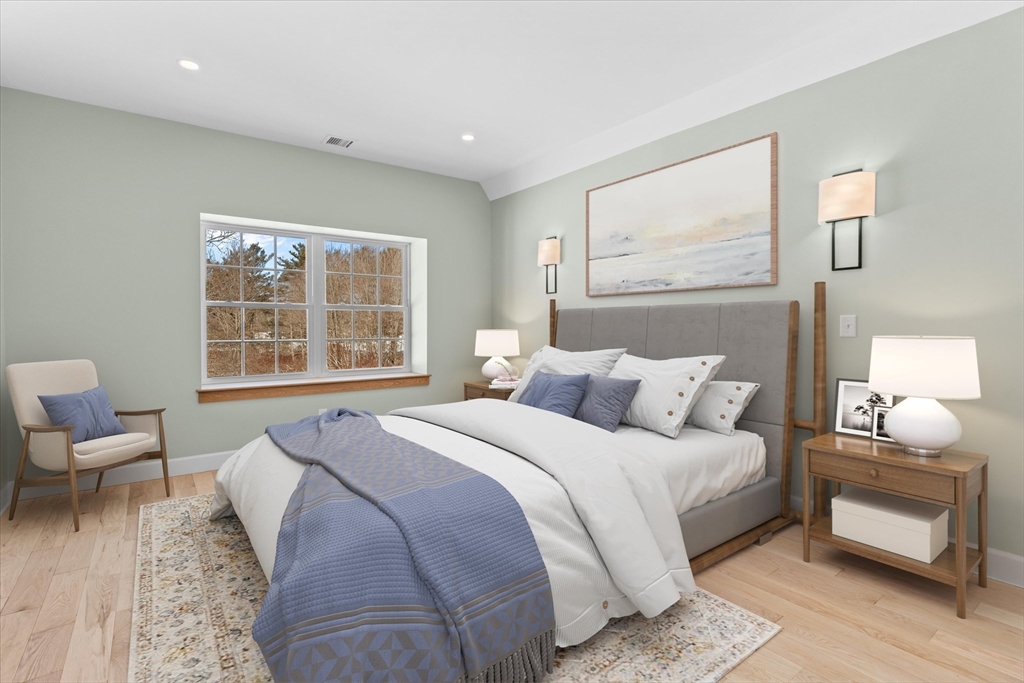 7 Justin Circle York, ME 03909 - Photo 25 of 36 a bedroom with a bed and wooden floor