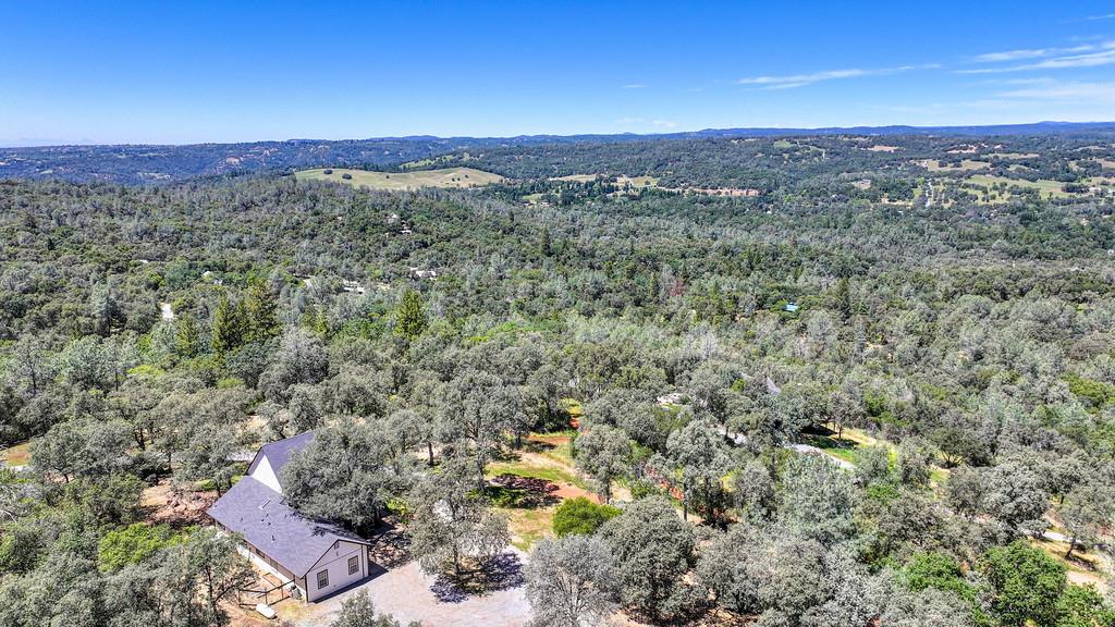 3154 Twin K Road Pilot Hill, CA 95664 - Photo 2 of 89 a view of a city with mountains in the background