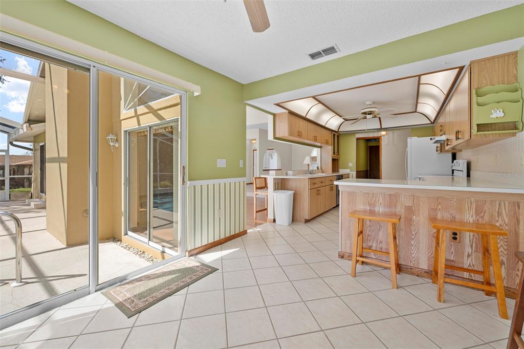1446 Cornell Avenue Spring Hill, FL 34609 - Photo 14 of 39 a spacious bathroom with a mirror a bathtub and next to a window