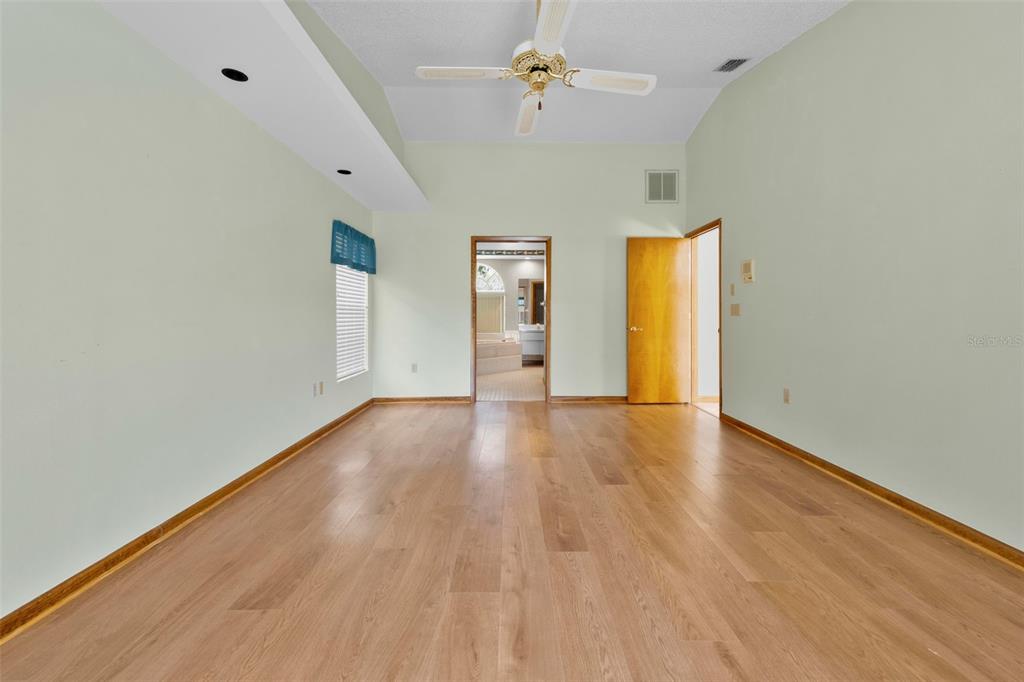 1446 Cornell Avenue Spring Hill, FL 34609 - Photo 19 of 39 wooden floor in an empty room with a window
