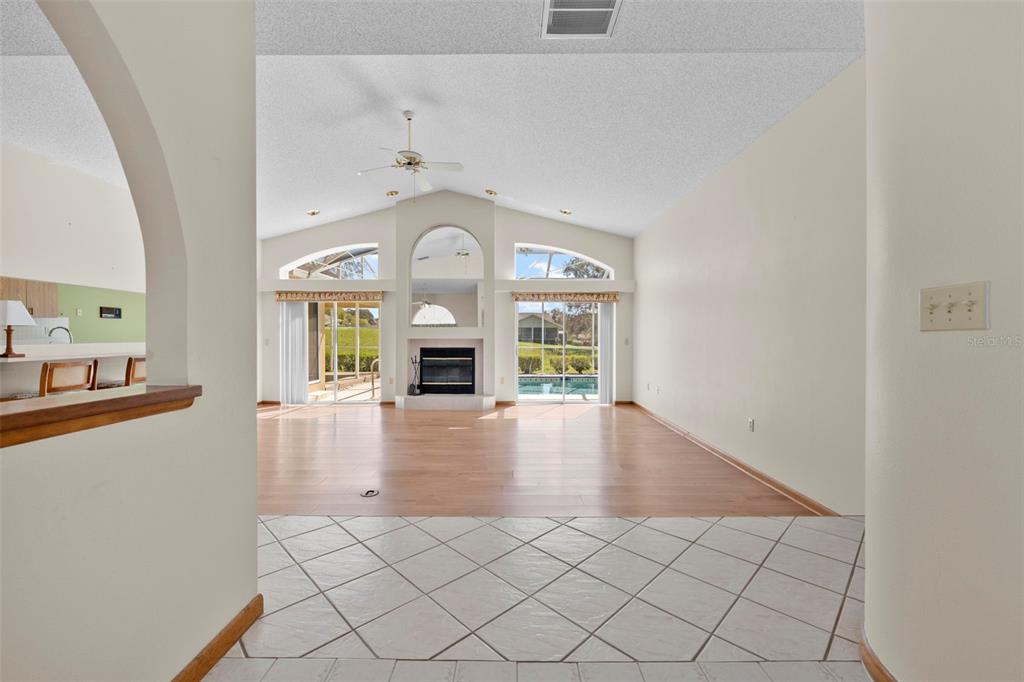 1446 Cornell Avenue Spring Hill, FL 34609 - Photo 3 of 39 a view of empty room with a fireplace