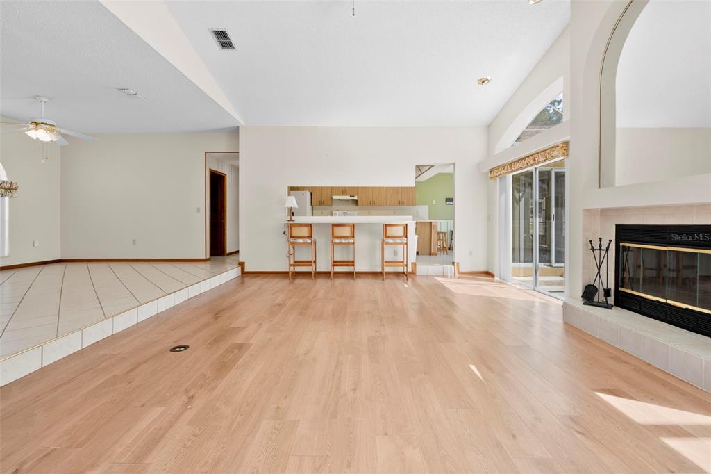 1446 Cornell Avenue Spring Hill, FL 34609 - Photo 10 of 39 a view of a livingroom with a fireplace and window