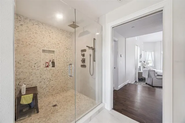 a bathroom with a sink toilet and shower