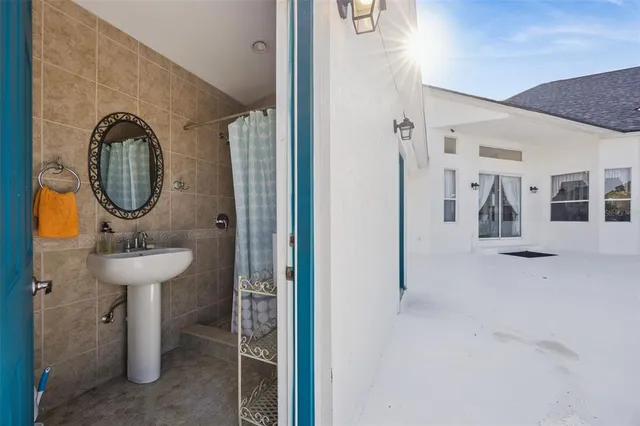 a view of a patio with swimming pool table and chairs