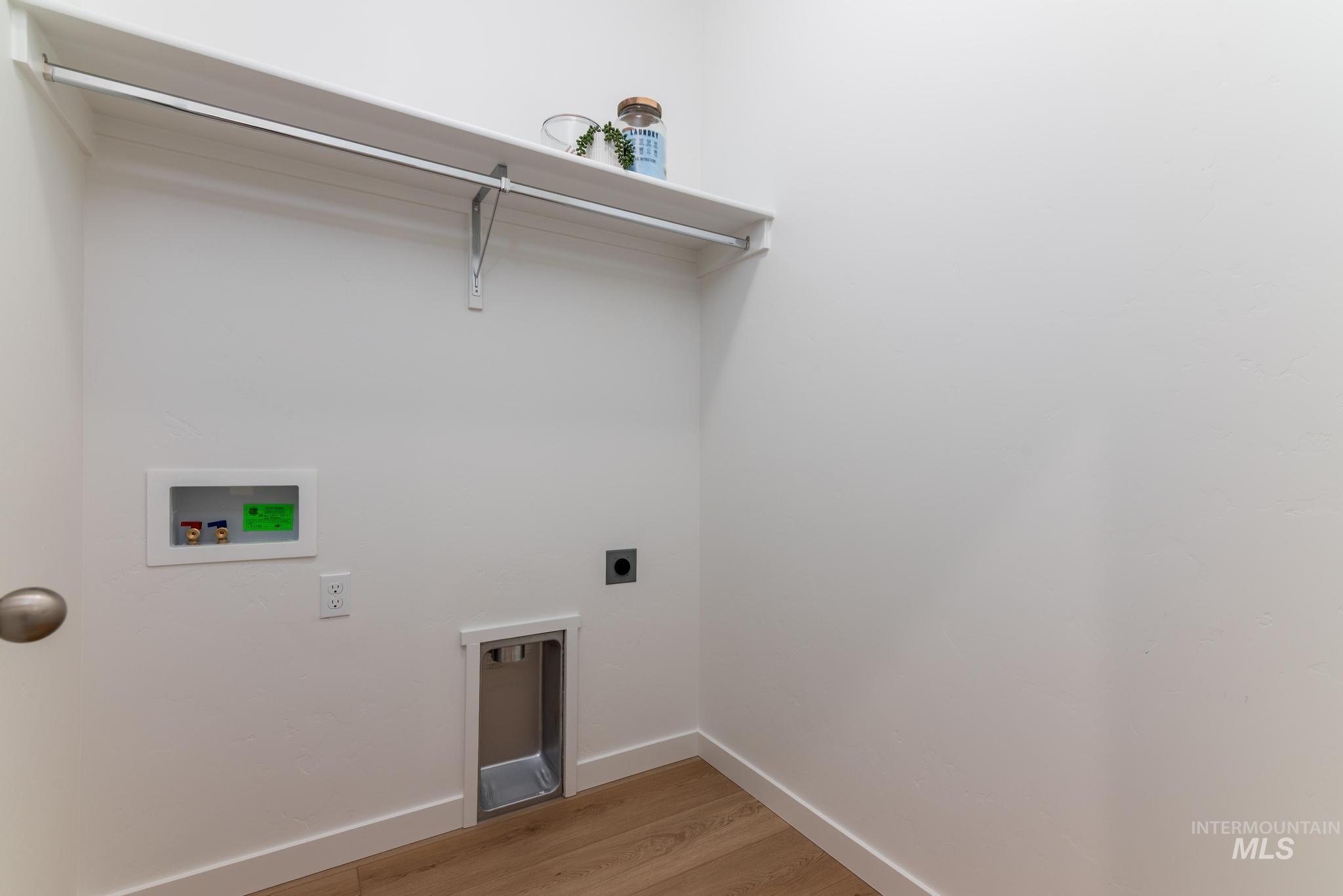 14726 Wing Spread Drive Caldwell, ID 83607 - Photo 23 of 35 Laundry room featuring electric dryer hookup, light wood-type flooring, and hookup for a washing machine