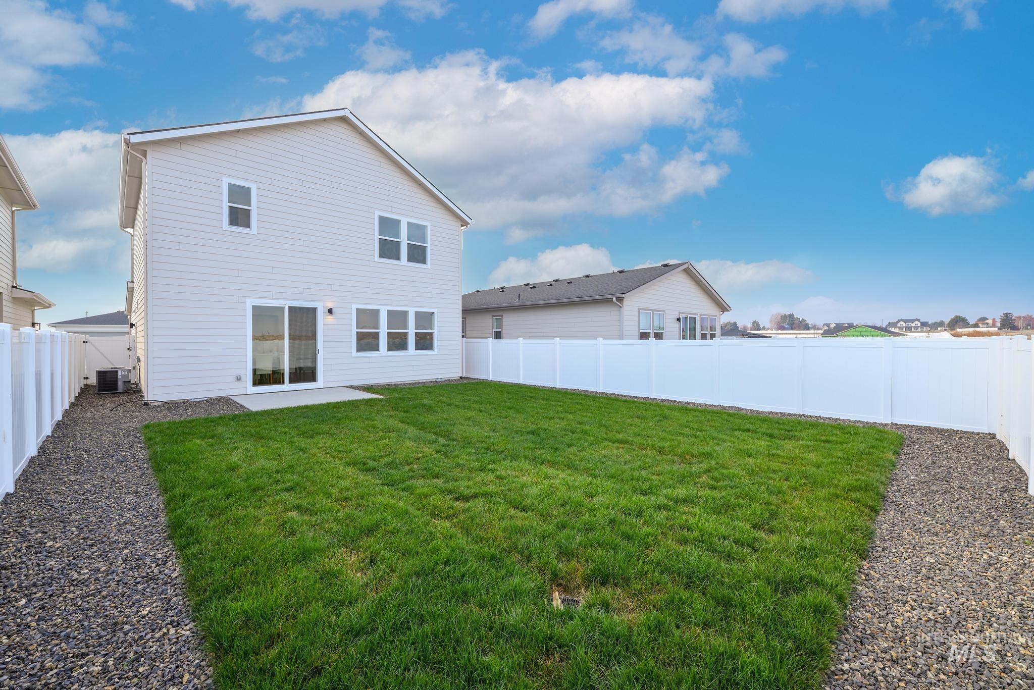 14726 Wing Spread Drive Caldwell, ID 83607 - Photo 25 of 35 Back of property with a patio and a fenced backyard