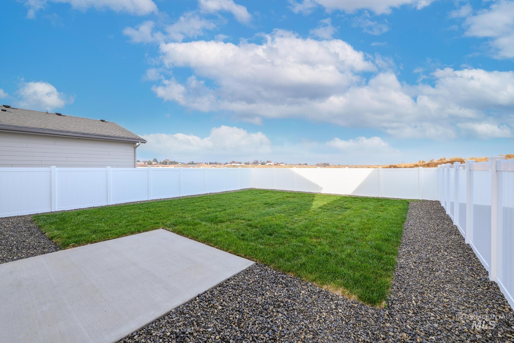 14726 Wing Spread Drive Caldwell, ID 83607 - Photo 26 of 35 Fenced backyard featuring a patio area
