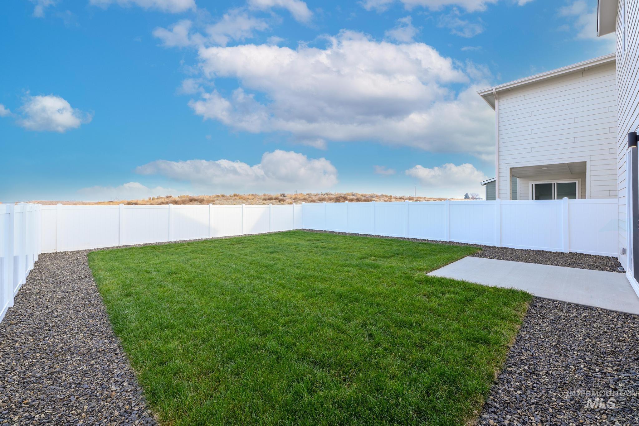 14726 Wing Spread Drive Caldwell, ID 83607 - Photo 27 of 35 Fenced backyard featuring a patio area