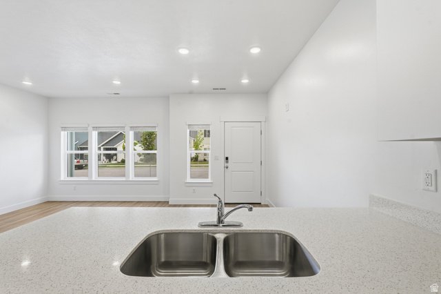 1173 West 1870 South Logan, UT 84321 - Photo 8 of 33 Kitchen counter with a double-basin stainless steel sink and a chrome faucet