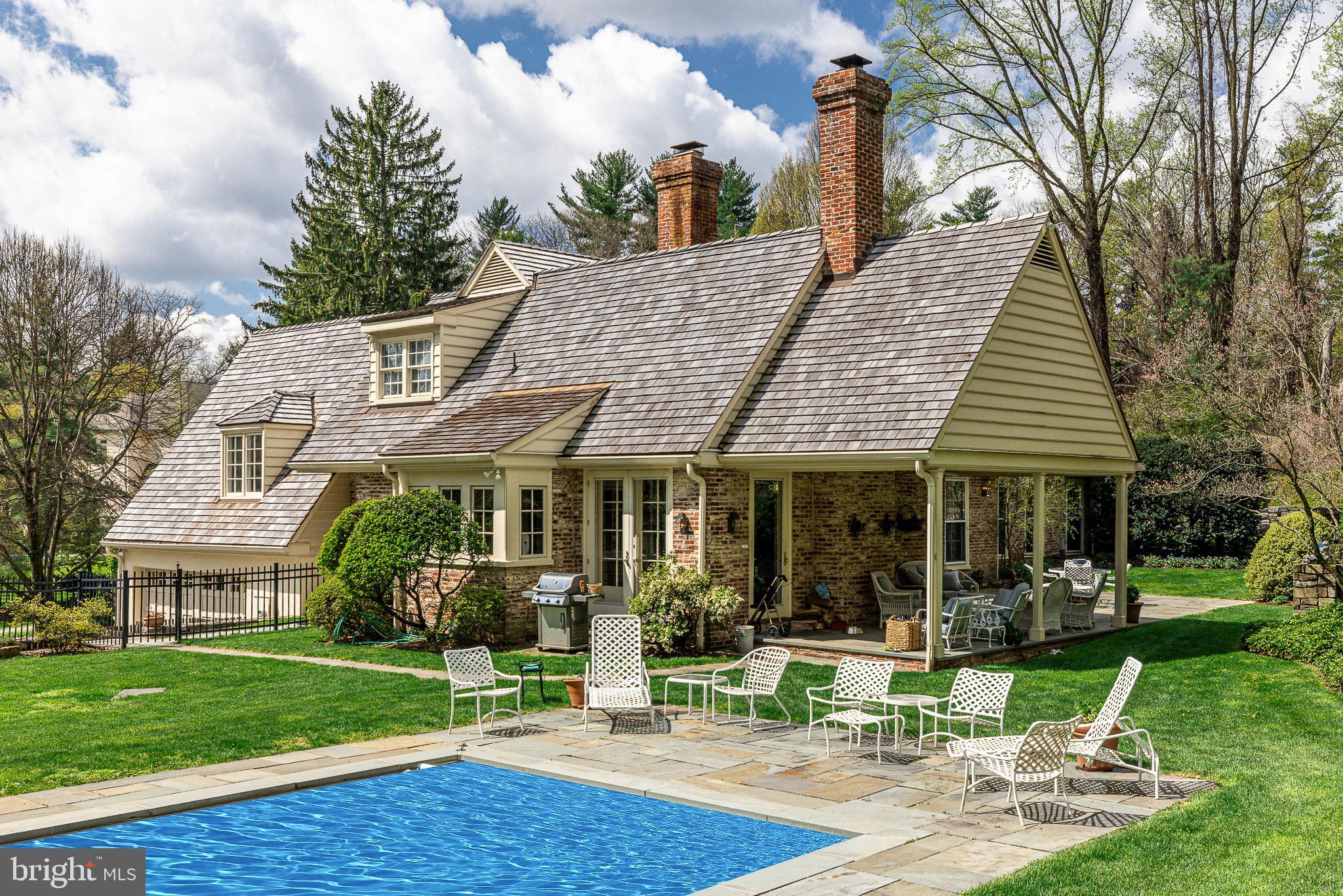 a view of a house with garden and plants