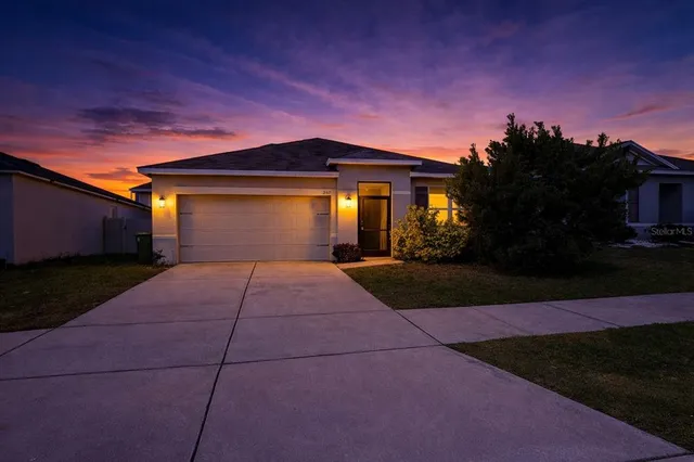 a front view of a house with yard