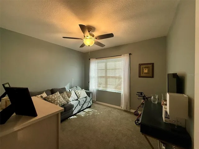 a bed room with furniture and a window