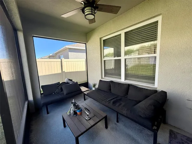 a living room with furniture and a window