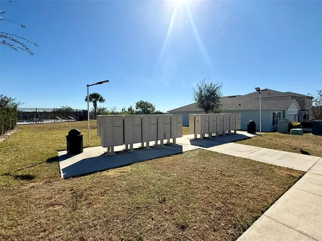 a bedroom with a bed and a night stand