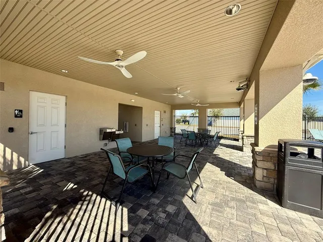 a living room with lots of wooden furniture and a table