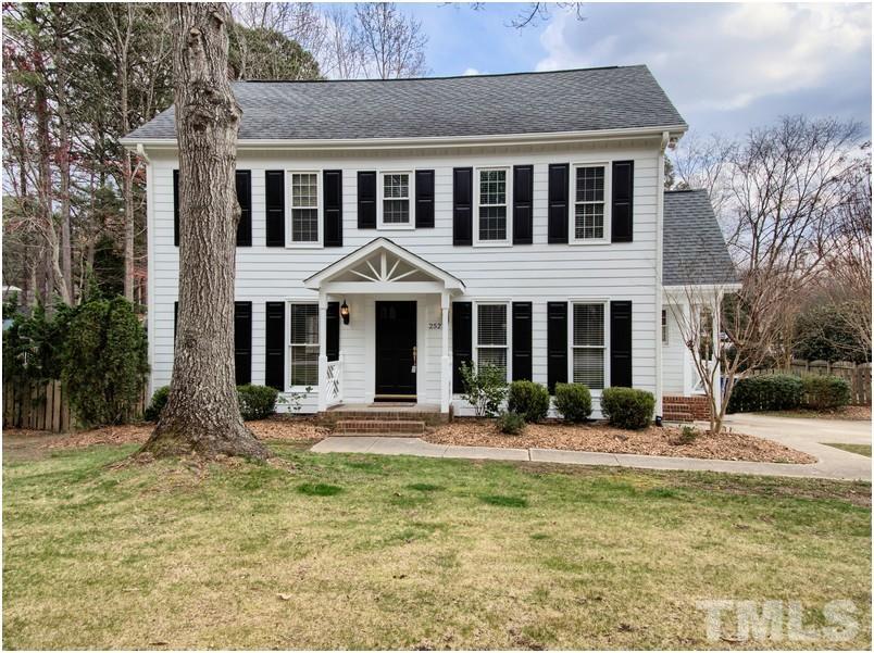 2521 Village Grove Road Raleigh, NC 27613 - Photo 1 of 25 a front view of a house with yard and green space