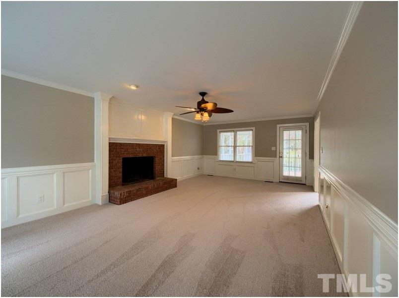 2521 Village Grove Road Raleigh, NC 27613 - Photo 12 of 25 a view of empty room with a fireplace