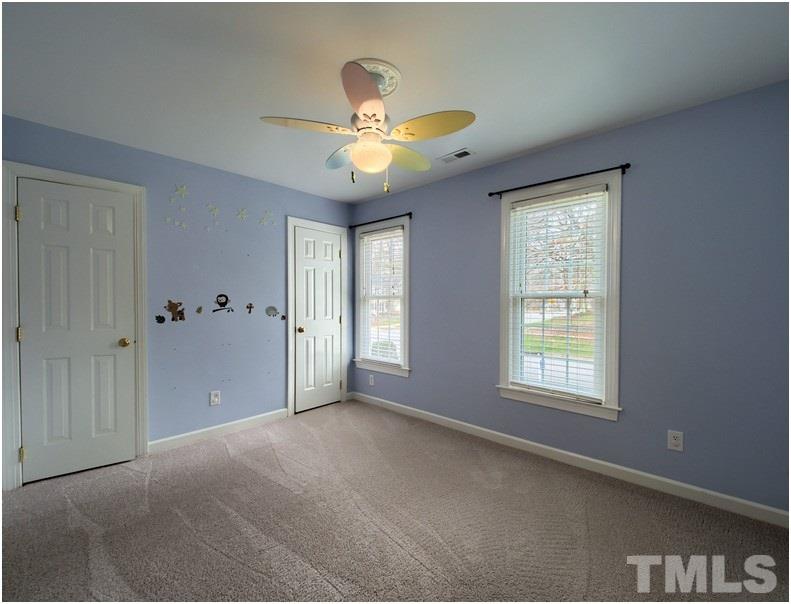 2521 Village Grove Road Raleigh, NC 27613 - Photo 19 of 25 a view of an empty room with a window