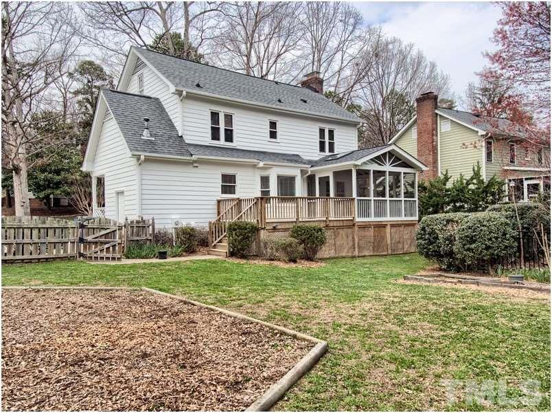 2521 Village Grove Road Raleigh, NC 27613 - Photo 23 of 25 a front view of a house with a yard