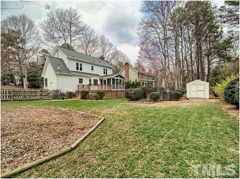 2521 Village Grove Road Raleigh, NC 27613 - Photo 24 of 25 a front view of a house with a yard