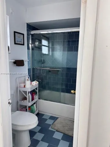 a view of cabinets a washer and dryer