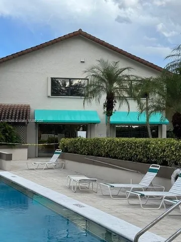 a park view with a bench and trees