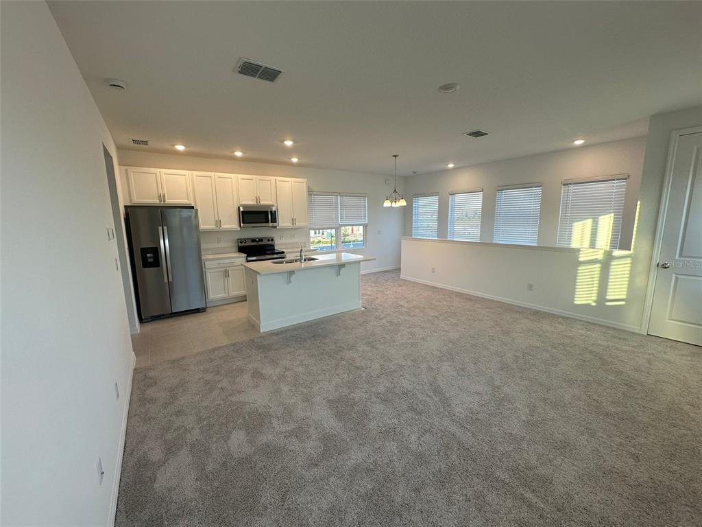 6718 Sherpa Trail, Unit A St. Cloud, FL 34771 - Photo 5 of 13 a view of kitchen and refrigerator