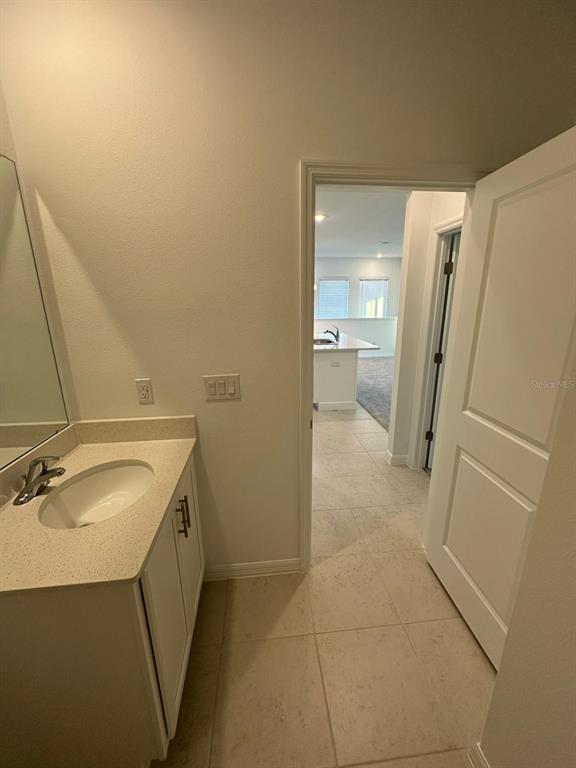 6718 Sherpa Trail, Unit A St. Cloud, FL 34771 - Photo 8 of 13 a bathroom with a sink toilet and shower