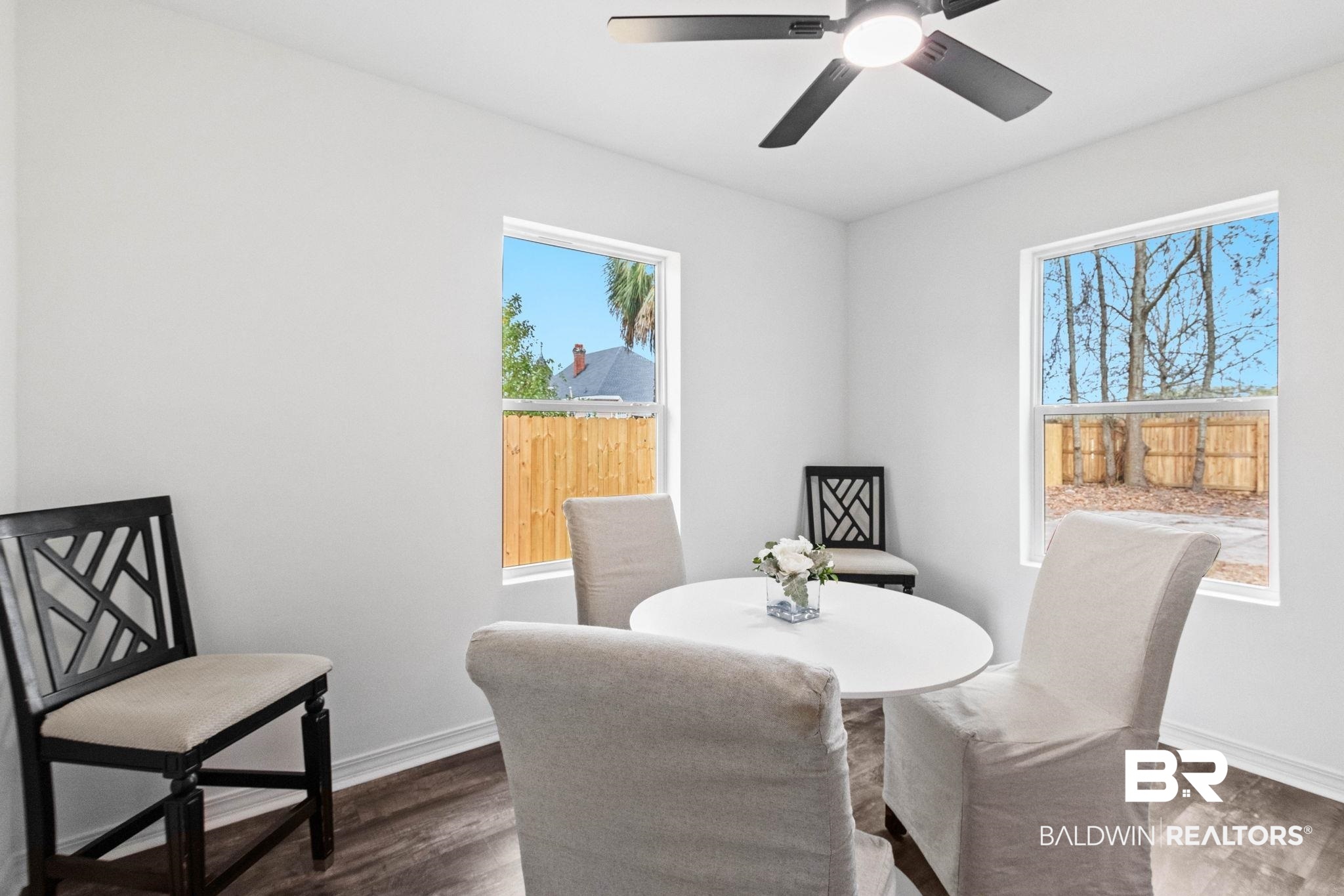 128 Bush Avenue Mobile, AL 36604 - Photo 16 of 40 Dining space with wood finished floors and ceiling fan