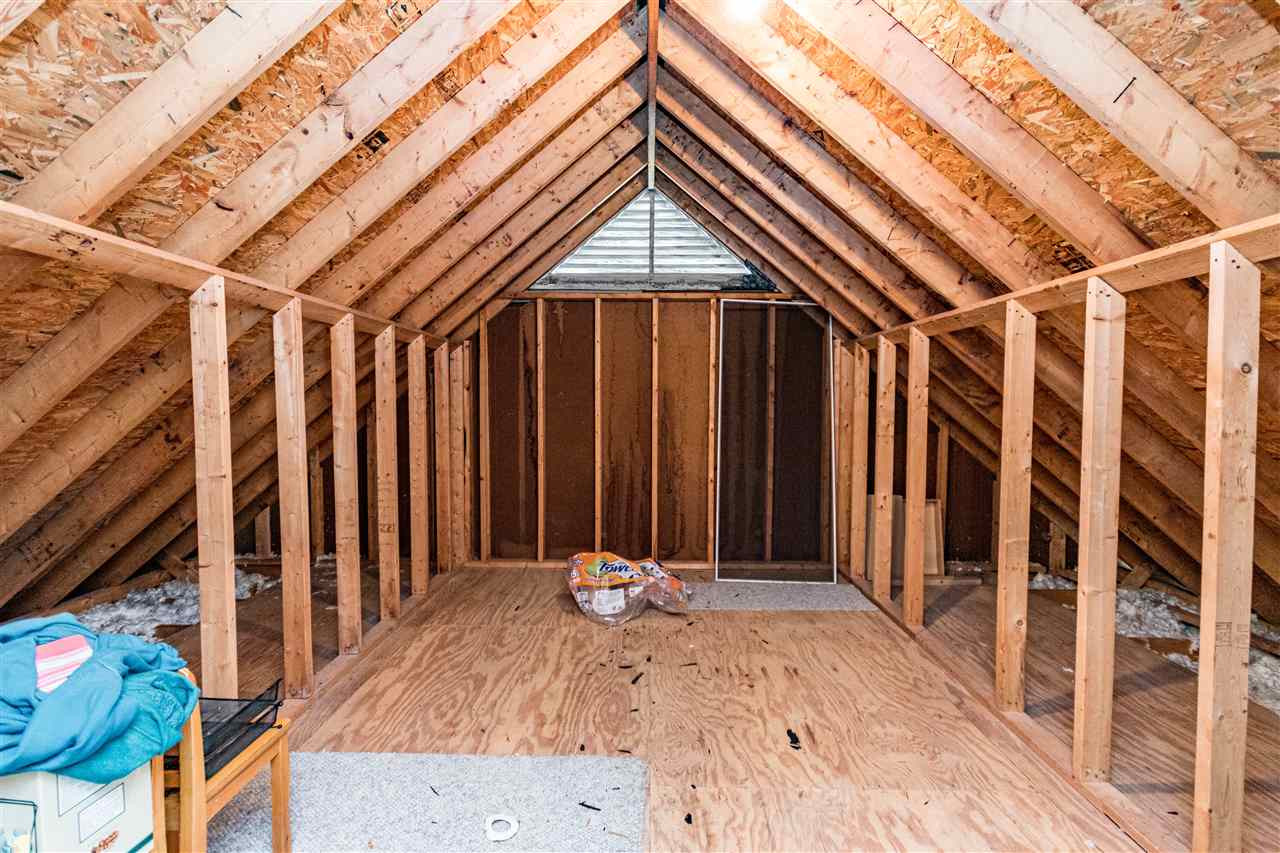 4233 Fowler Ridge Drive Raleigh, NC 27616 - Photo 20 of 28 Great walk in attic storage space. Off the Bonus Room Unfinished Storage