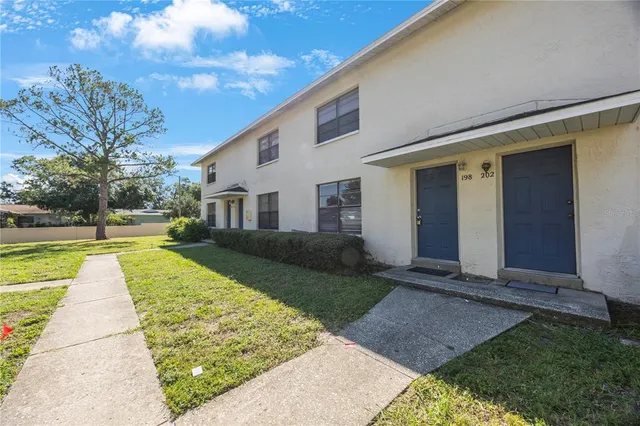 a view of house with yard
