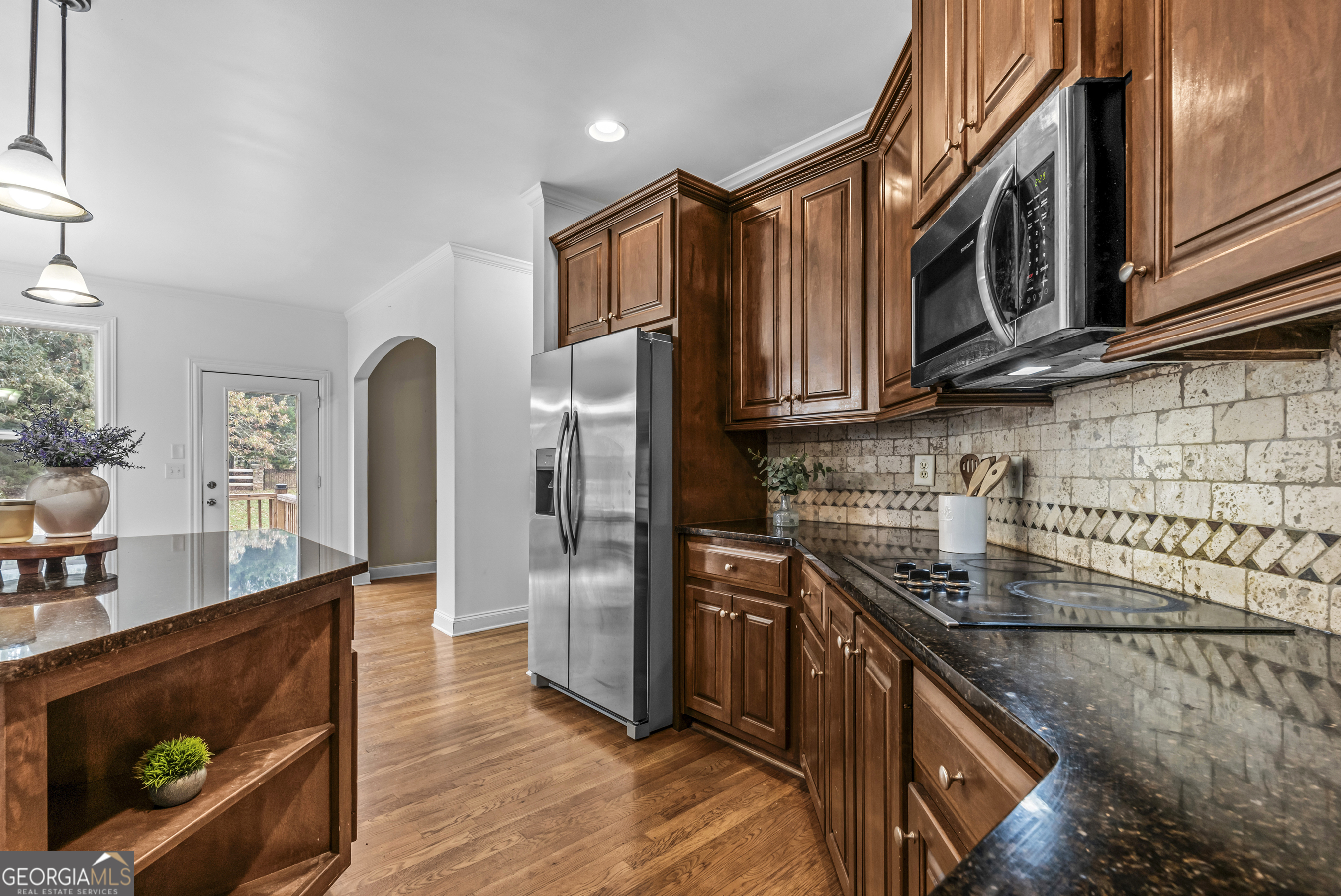 463 Delaperriere Loop Jefferson, GA 30549 - Photo 14 of 75 a kitchen with stainless steel appliances granite countertop a refrigerator a stove and a sink