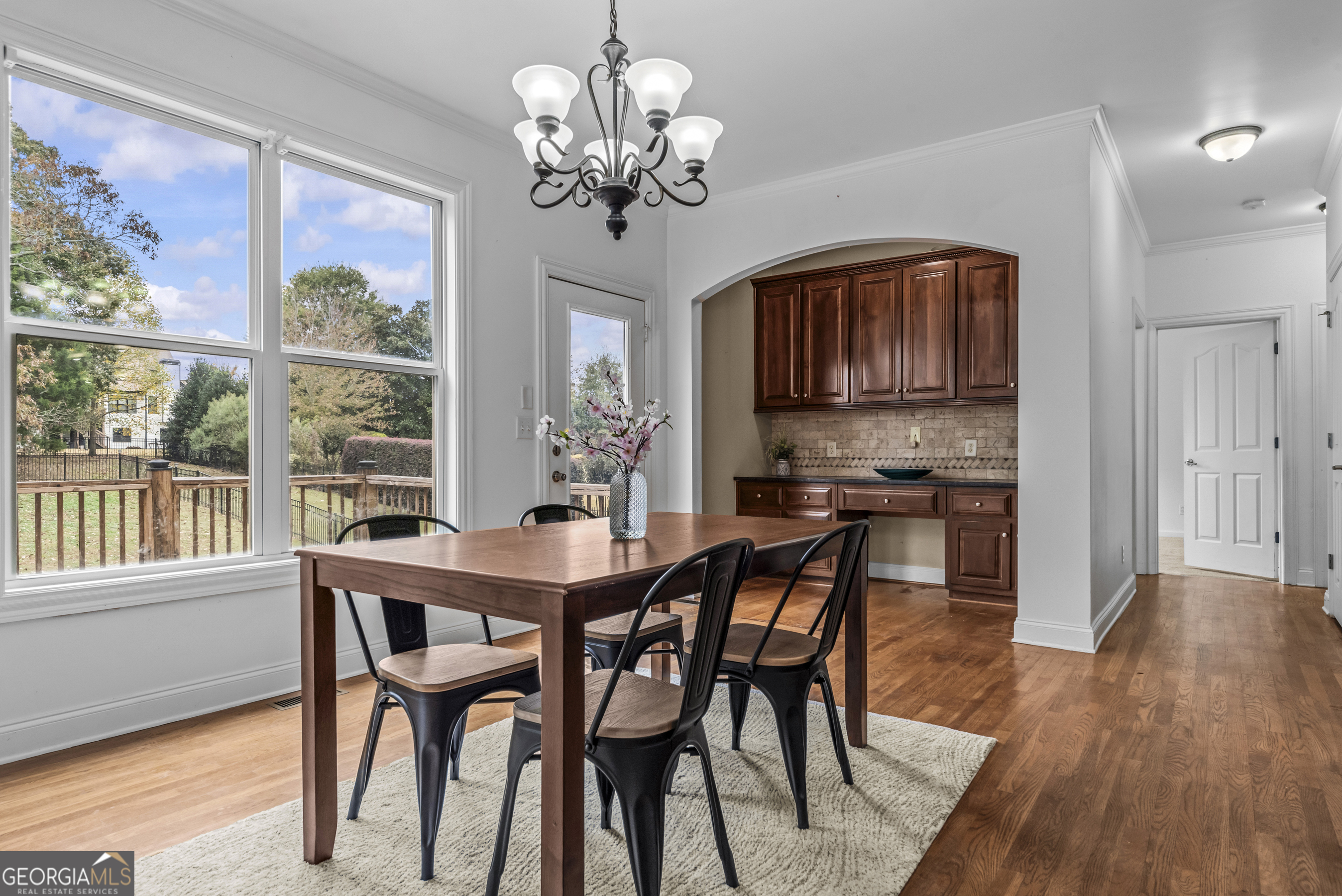 463 Delaperriere Loop Jefferson, GA 30549 - Photo 16 of 75 a view of a dining room with furniture wooden floor and chandelier